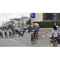 Người đi xe đạp khi chuyển hướng báo hiệu trước bằng cách nào?