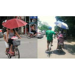 Có xử phạt hành chính khi vừa lái xe đạp vừa sử dụng ô dù không?