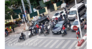 Xử phạt đối với xe máy về lỗi đè vạch và không xi nhan qua đường ?