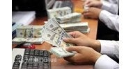 Nhận ngoại tệ qua ngân hàng có phải nộp thuế GTGT không?