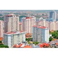 Điều kiện chuyển nhượng quyền sử dụng đất gắn với việc chuyển nhượng một phần hoặc toàn bộ dự án đầu tư xây dựng kinh doanh nhà ở?