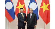Có thể dùng Việt Nam đồng là đồng tiền thanh toán trong các giao dịch thương mại giữa Việt Nam và Lào không?