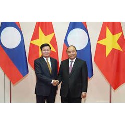 Có thể dùng Việt Nam đồng là đồng tiền thanh toán trong các giao dịch thương mại giữa Việt Nam và Lào không?