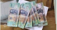 Dùng tiền giả mua hàng hóa phạm tội gì? Bị phạt bao nhiêu năm tù?